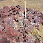 Red Hill outcrop, copper staining in brecciated jasperoids developed in rocks of the Candelaria formation. Sample 16902 reported 1.5% Cu over 1 meter.